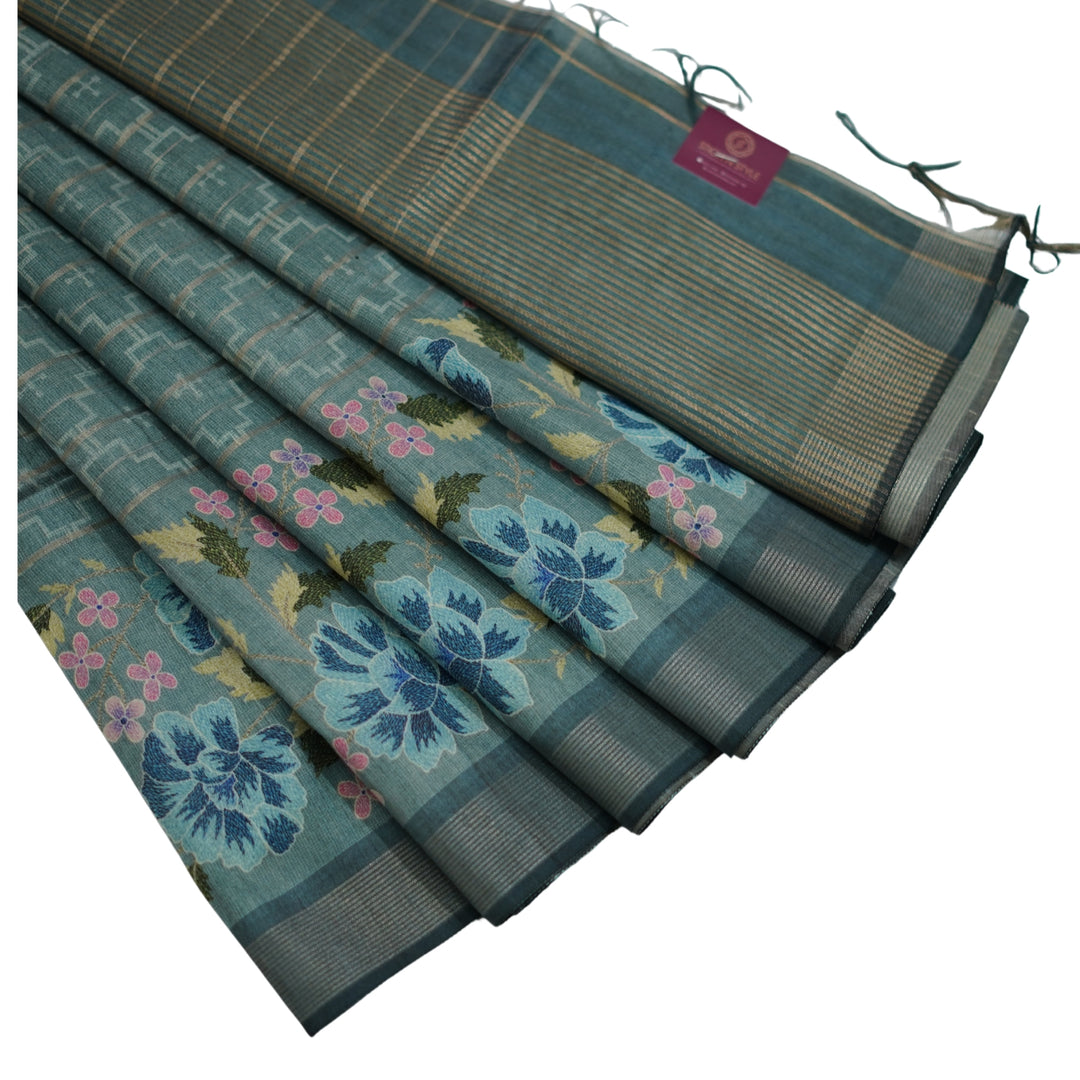 Raw silk saree with all over geomentrical design and floral weaving border.