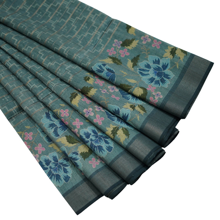Raw silk saree with all over geomentrical design and floral weaving border.