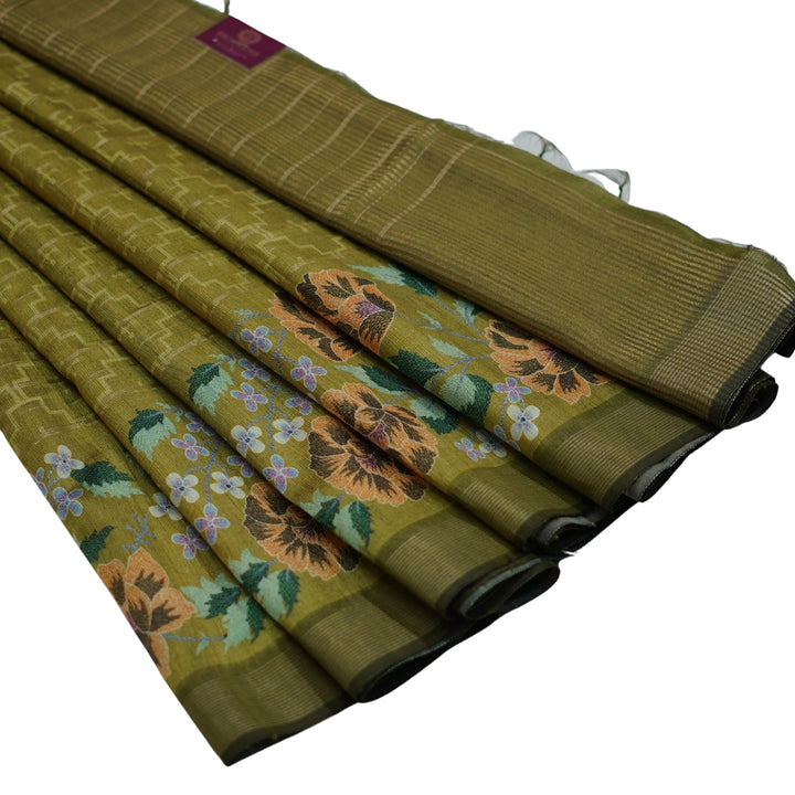 Raw silk saree with all over geomentrical design and floral weaving border.