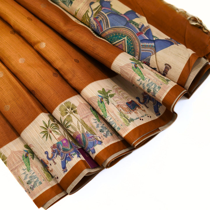 Silk cotton saree with all over buttas and digital print border.