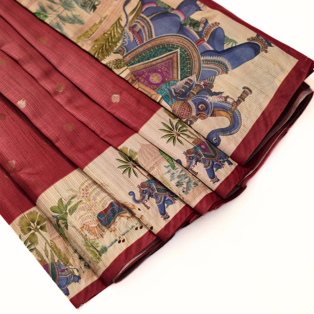 Silk cotton saree with all over buttas and digital print border.