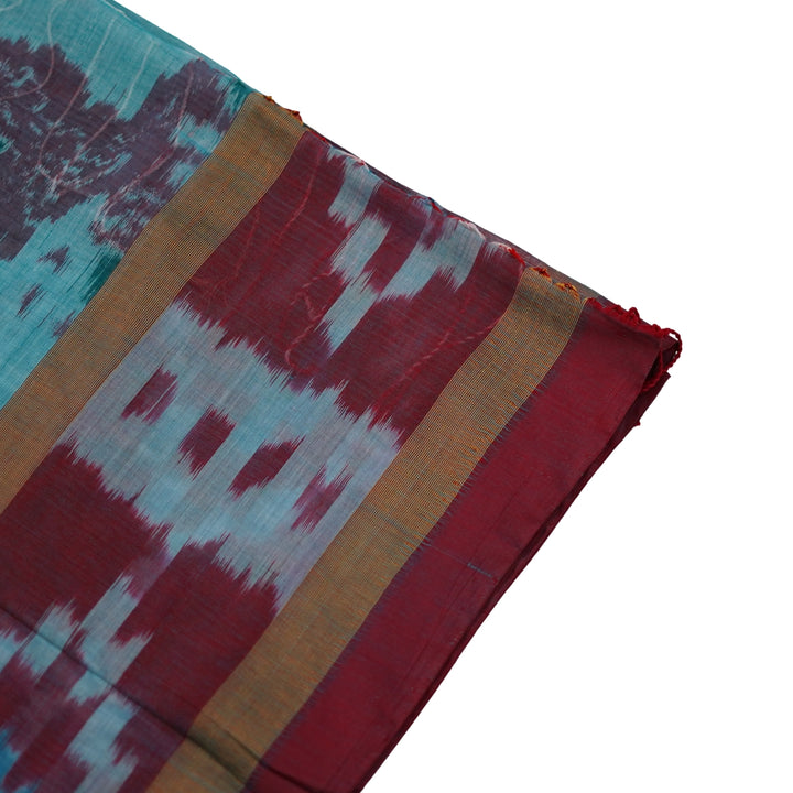 Ikkat cotton saree with small zari border.