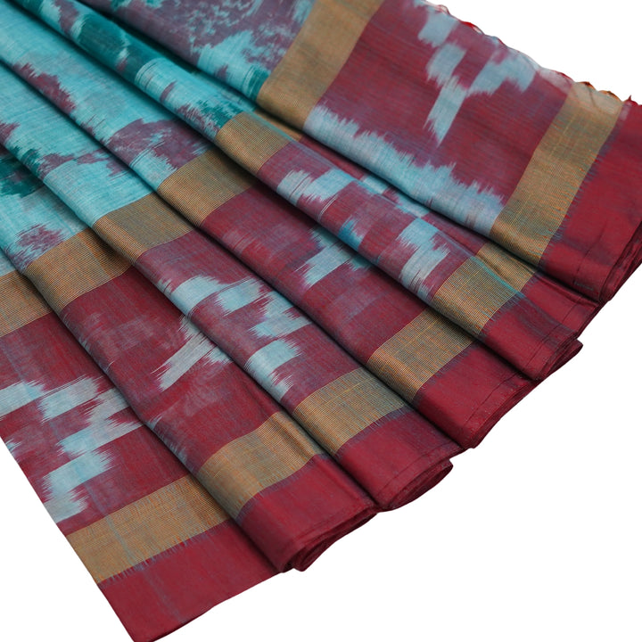 Ikkat cotton saree with small zari border.