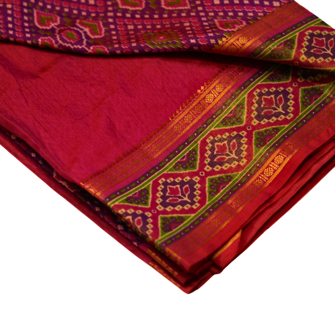 Raw silk saree with pochampalli design and tissue zari weaving.