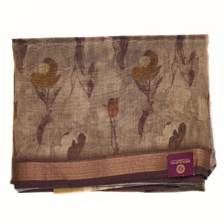 Tissue organza saree with zari border and all over prints.