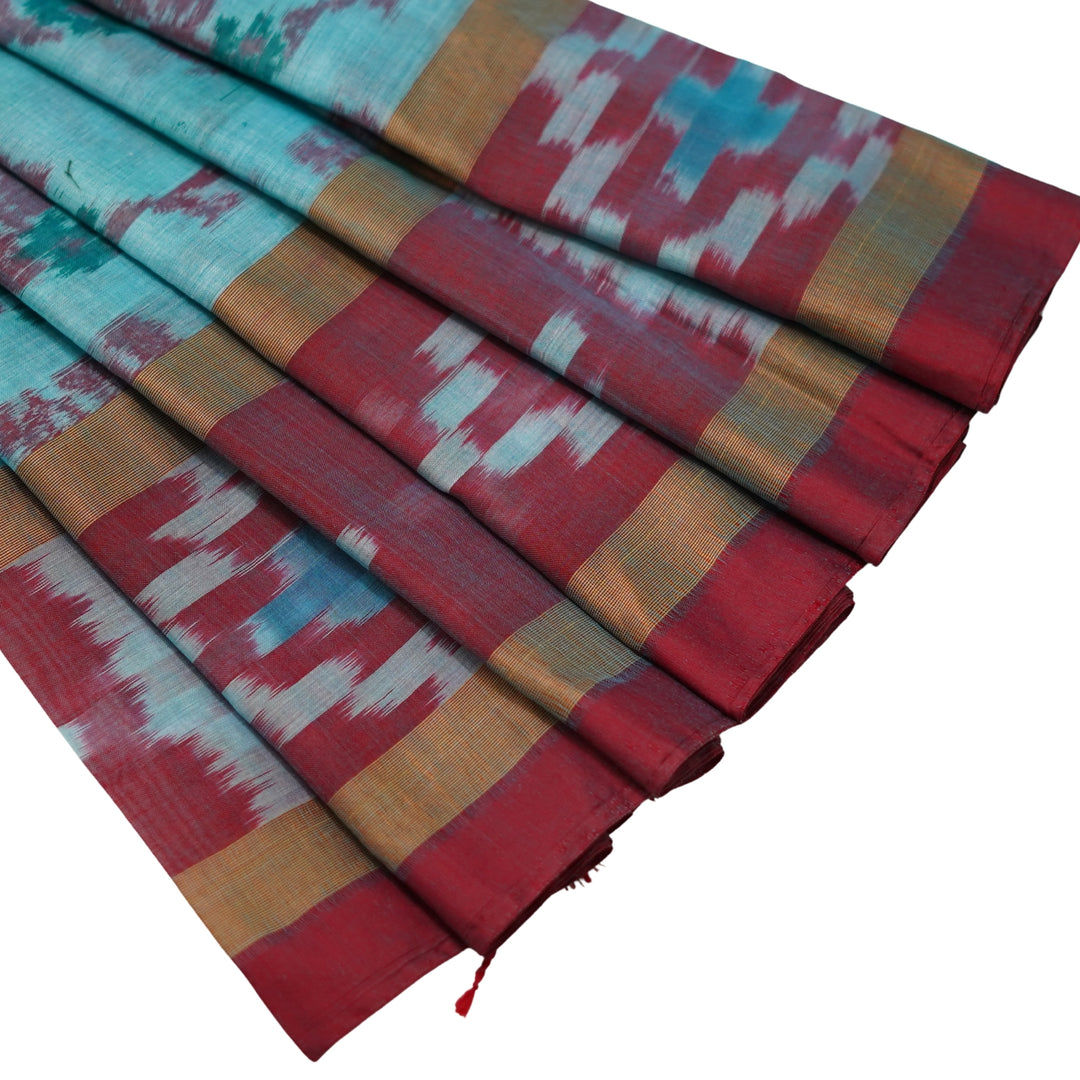 Ikkat cotton saree with small zari border.