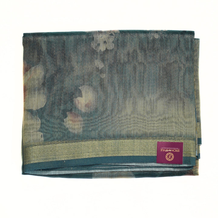 Tissue organza saree with zari border and all over prints.