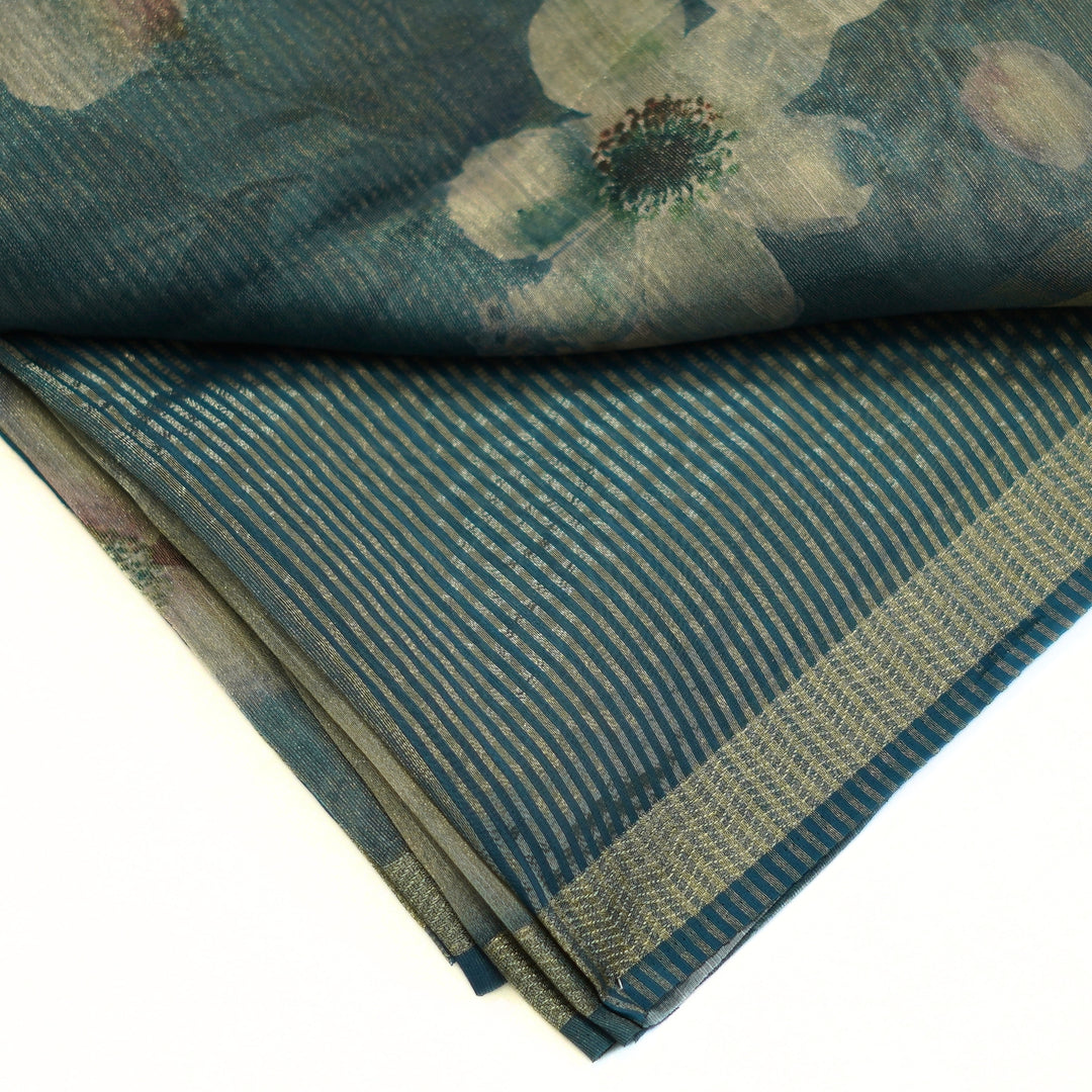Tissue organza saree with zari border and all over prints.