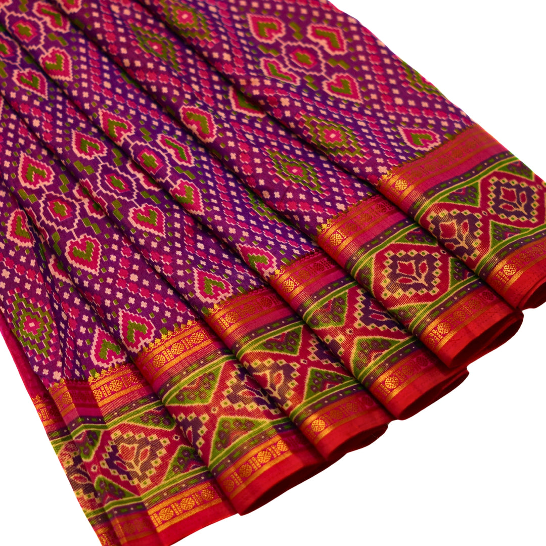 Raw silk saree with pochampalli design and tissue zari weaving.