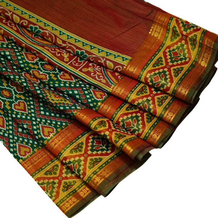 Raw silk saree with pochampalli design and tissue zari weaving.