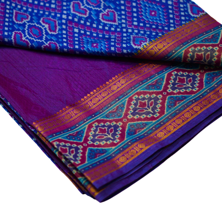 Raw silk saree with pochampalli design and tissue zari weaving.
