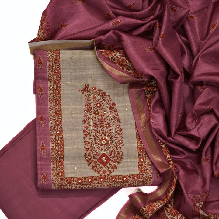 Tussar salwar set with neck yoke work and embroidery and tussar dhupatta.