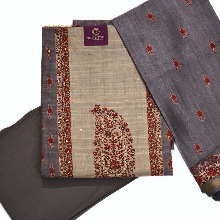 Tussar salwar set with neck yoke work and embroidery and tussar dhupatta.