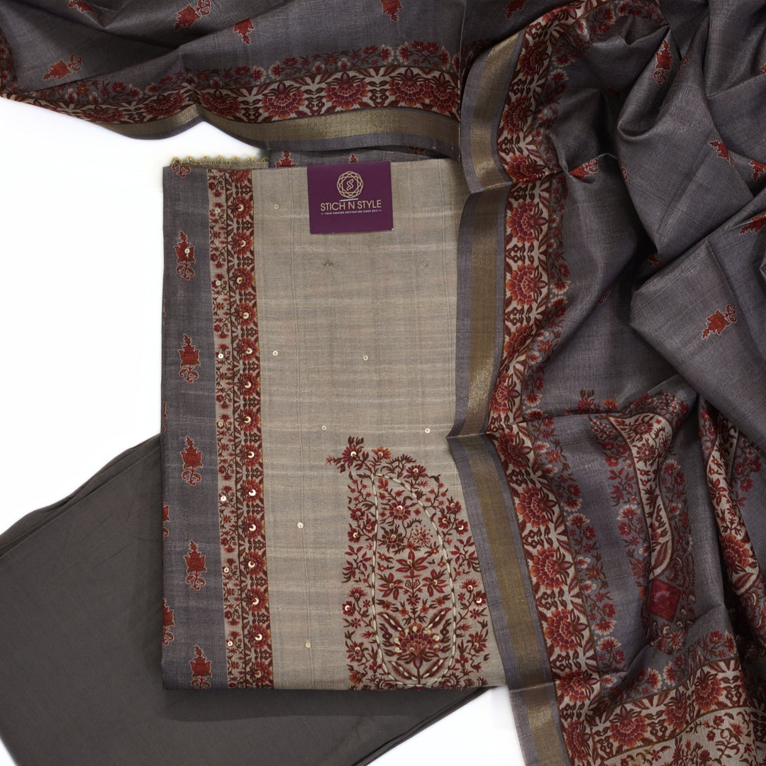 Tussar salwar set with neck yoke work and embroidery and tussar dhupatta.