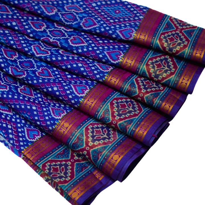 Raw silk saree with pochampalli design and tissue zari weaving.