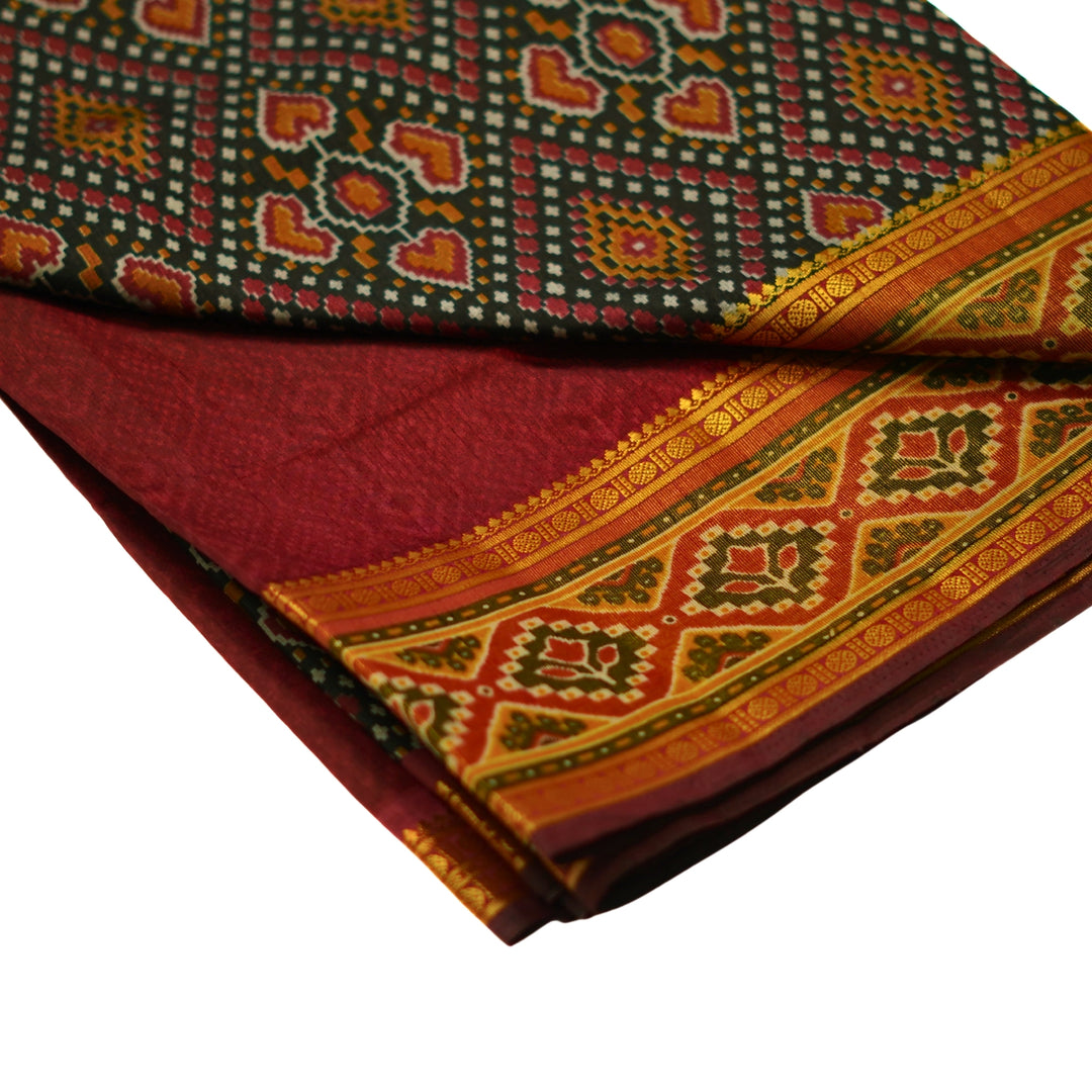 Raw silk saree with pochampalli design and tissue zari weaving.