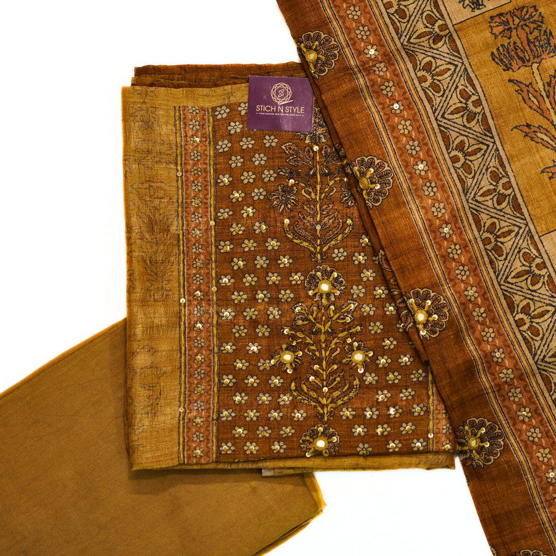 Tussar salwar set with yoke print and hand work and tusser dhupatta with digital print.