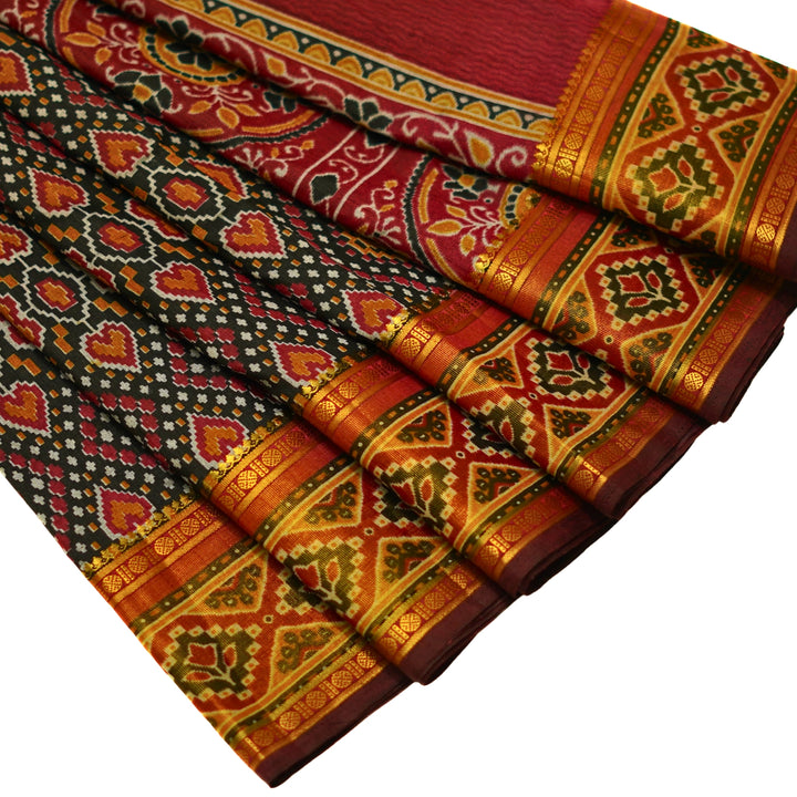 Raw silk saree with pochampalli design and tissue zari weaving.