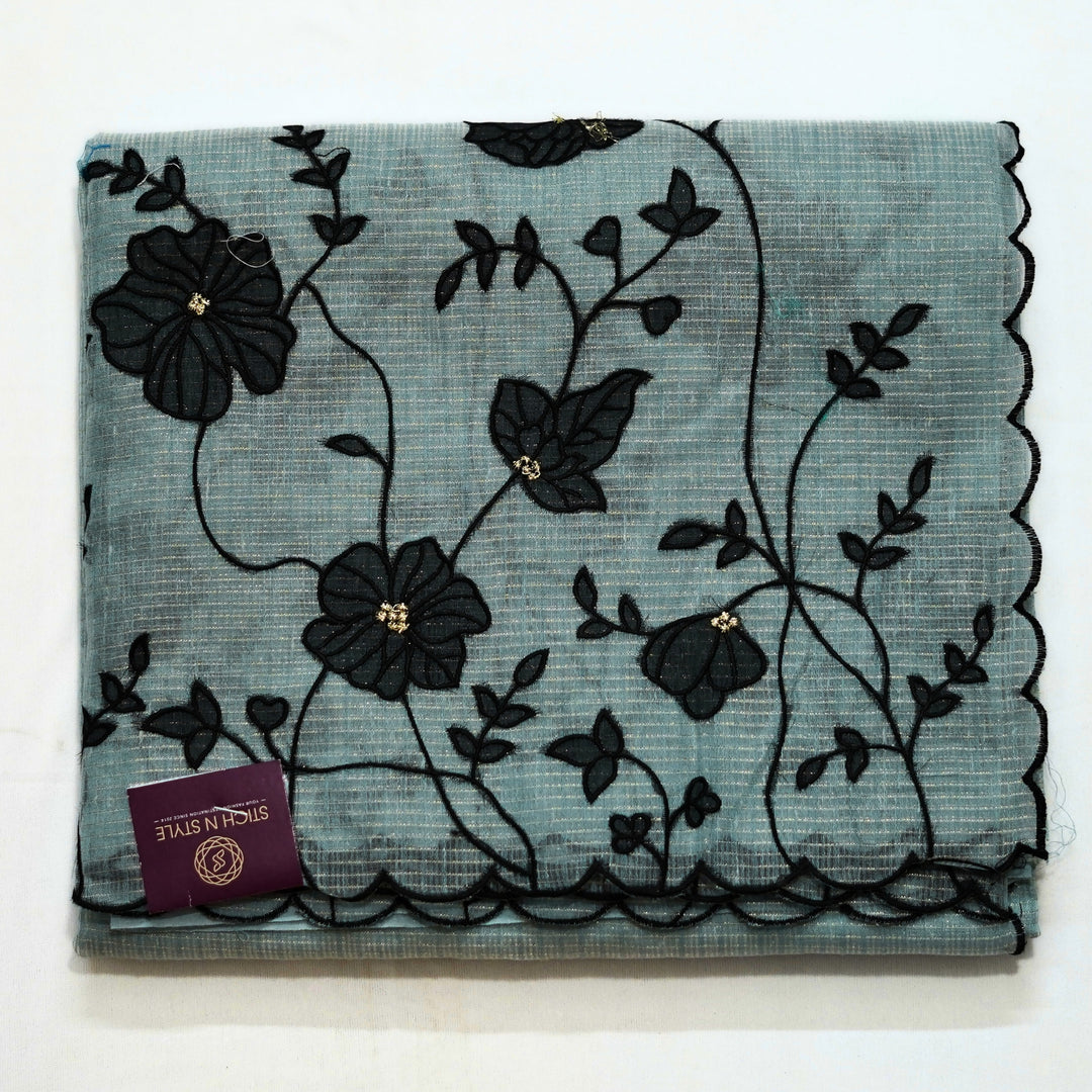 Tissue kotta saree with all over floral aplique work.