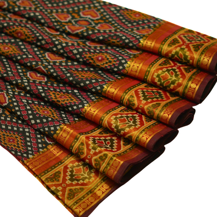 Raw silk saree with pochampalli design and tissue zari weaving.