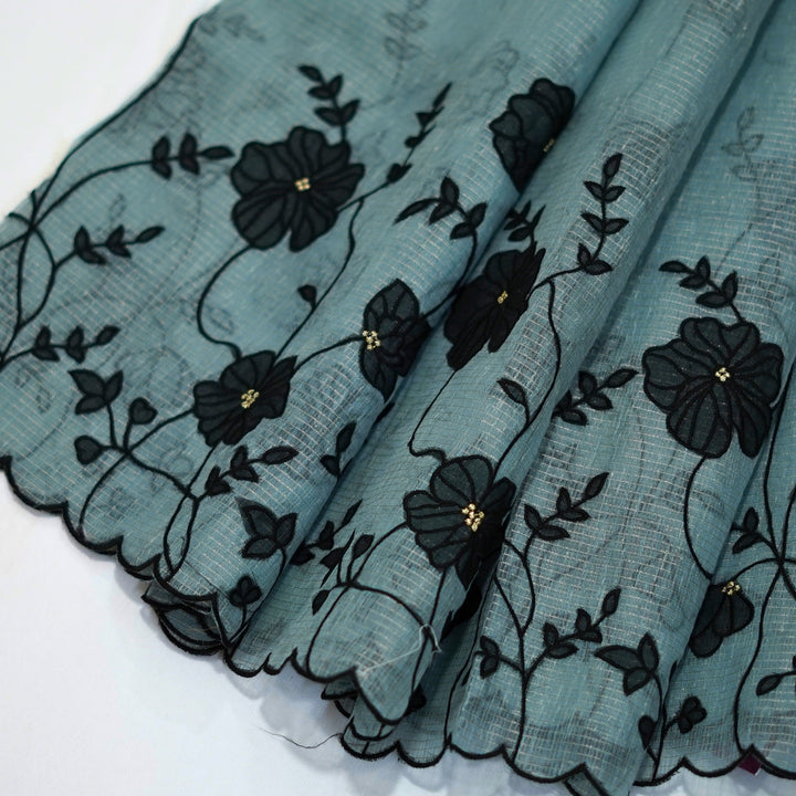 Tissue kotta saree with all over floral aplique work.