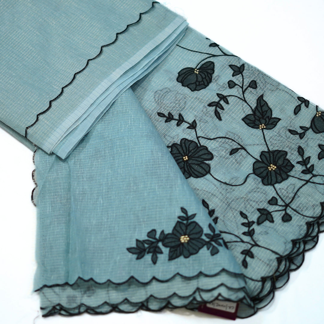 Tissue kotta saree with all over floral aplique work.