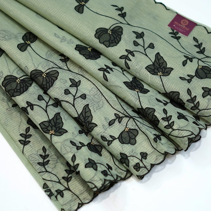 Tissue kotta saree with all over floral aplique work.