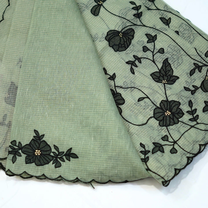 Tissue kotta saree with all over floral aplique work.
