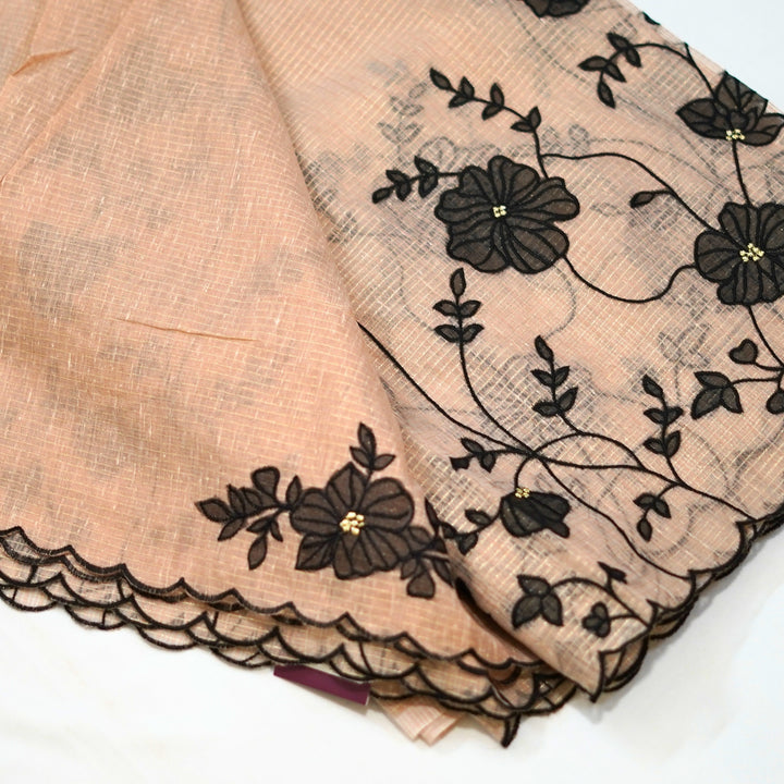 Tissue kotta saree with all over floral aplique work.