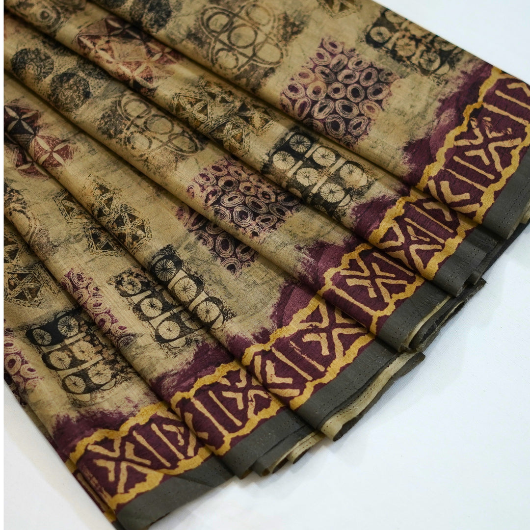 Semi tussar saree with geomentrical print all over, with a beautiful border for office wear.