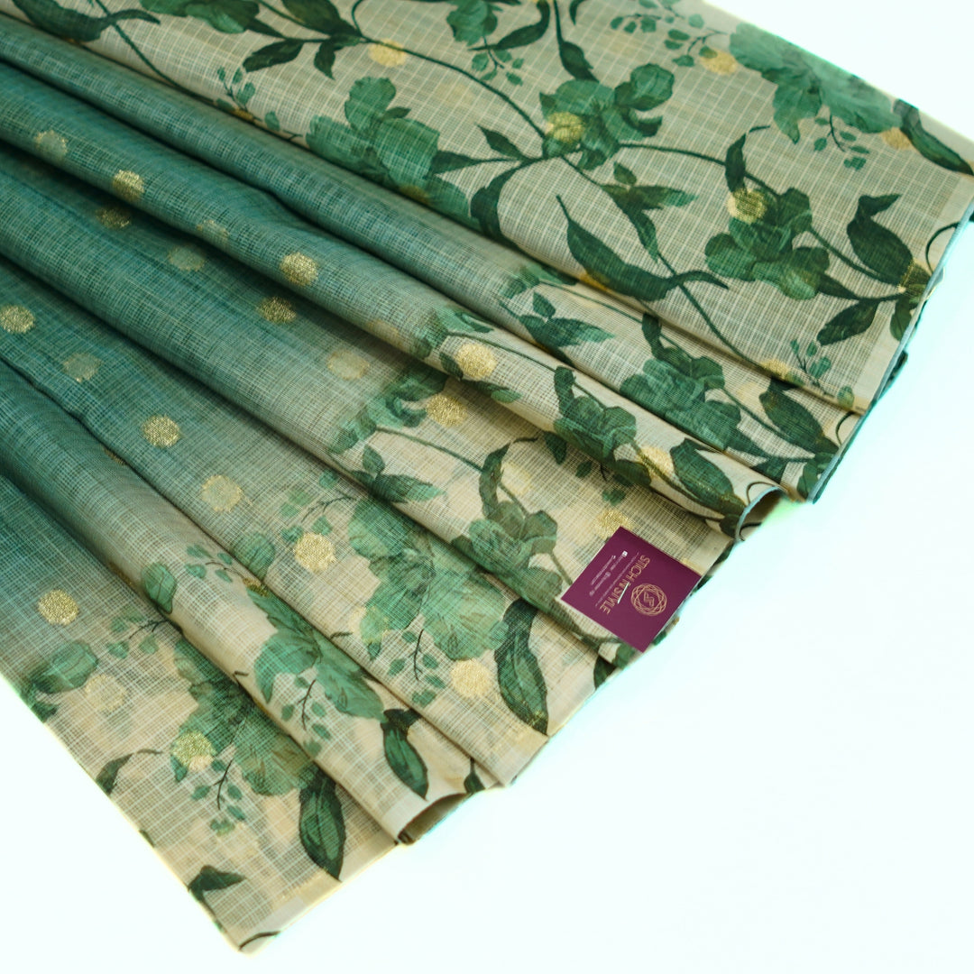 Kotta saree with all over zari butta and digital print floral border.