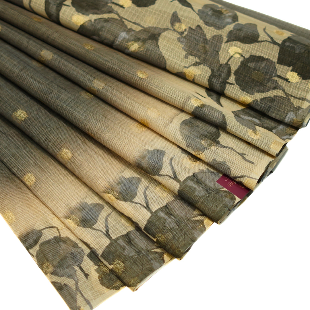 Kotta saree with all over zari butta and digital print floral border.