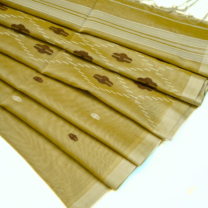 Pure bengal cotton saree with buttas all over, with rich pallu.