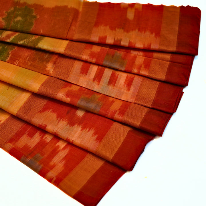 Ikkat cotton saree with small zari border.