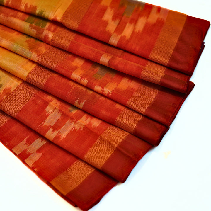 Ikkat cotton saree with small zari border.