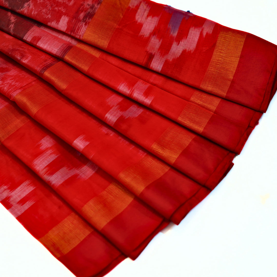 Ikkat cotton saree with small zari border.