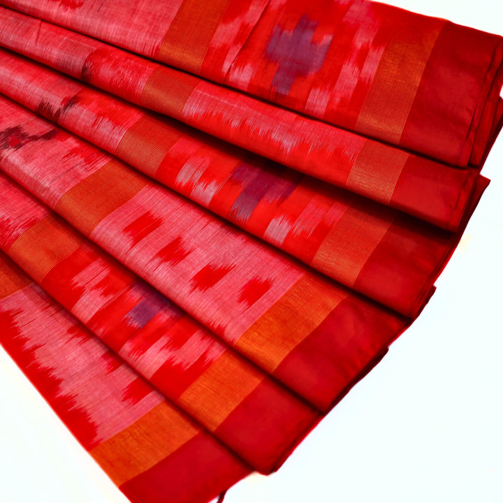 Ikkat cotton saree with small zari border.