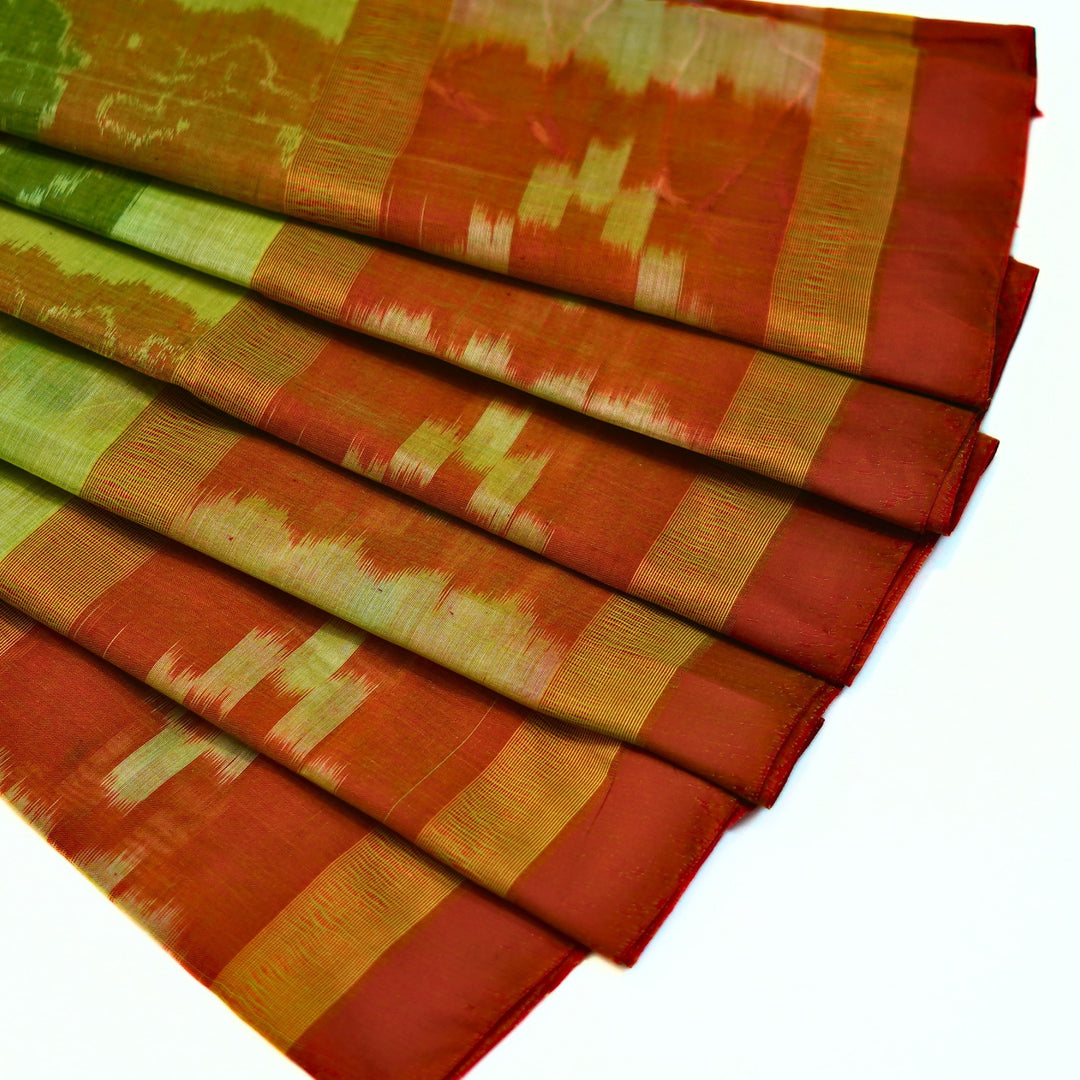 Ikkat cotton saree with small zari border.