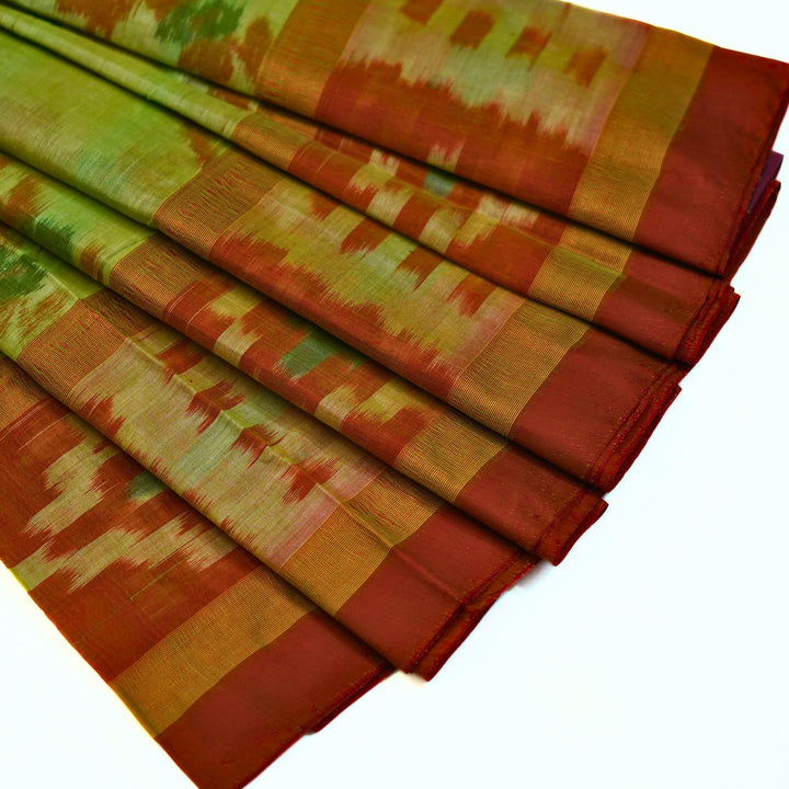 Ikkat cotton saree with small zari border.