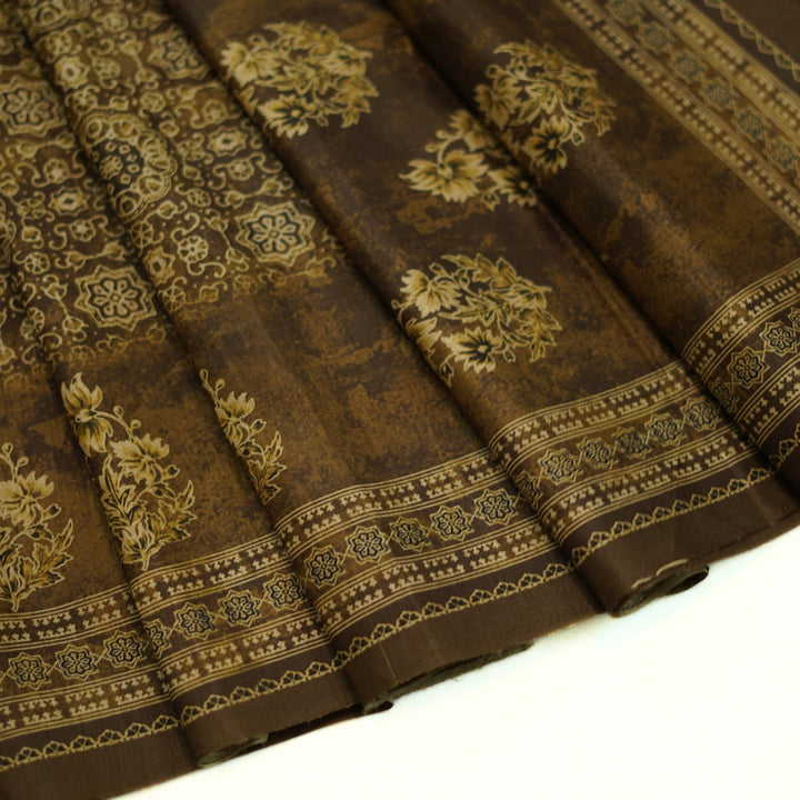 Tussar digital print saree with allover floral motif and border. Paired with a matching blouse